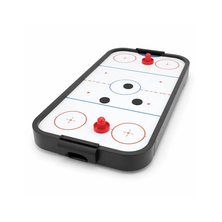Unbranded compact tabletop air hockey game with white playing surface and red strikers